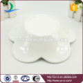 Tazón de cerámica blanca de porcelana de porcelana de la forma de la flor al por mayor